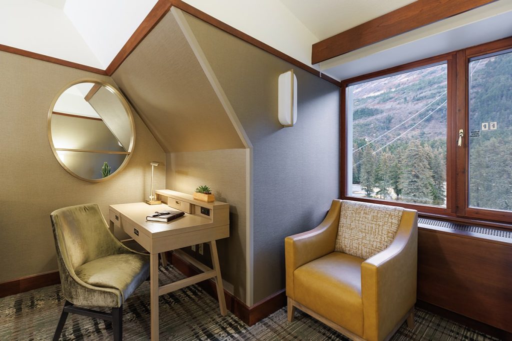 Spacious Club King room at Alyeska Resort with seating area and vanity/desk